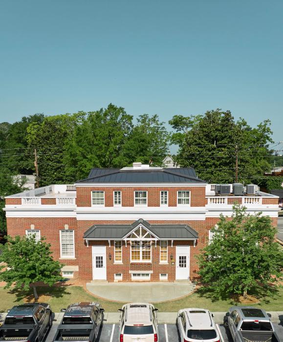 Drone image of AgSouth Farm Credit's newly-installed, black, standing-seam metal commericial roof.